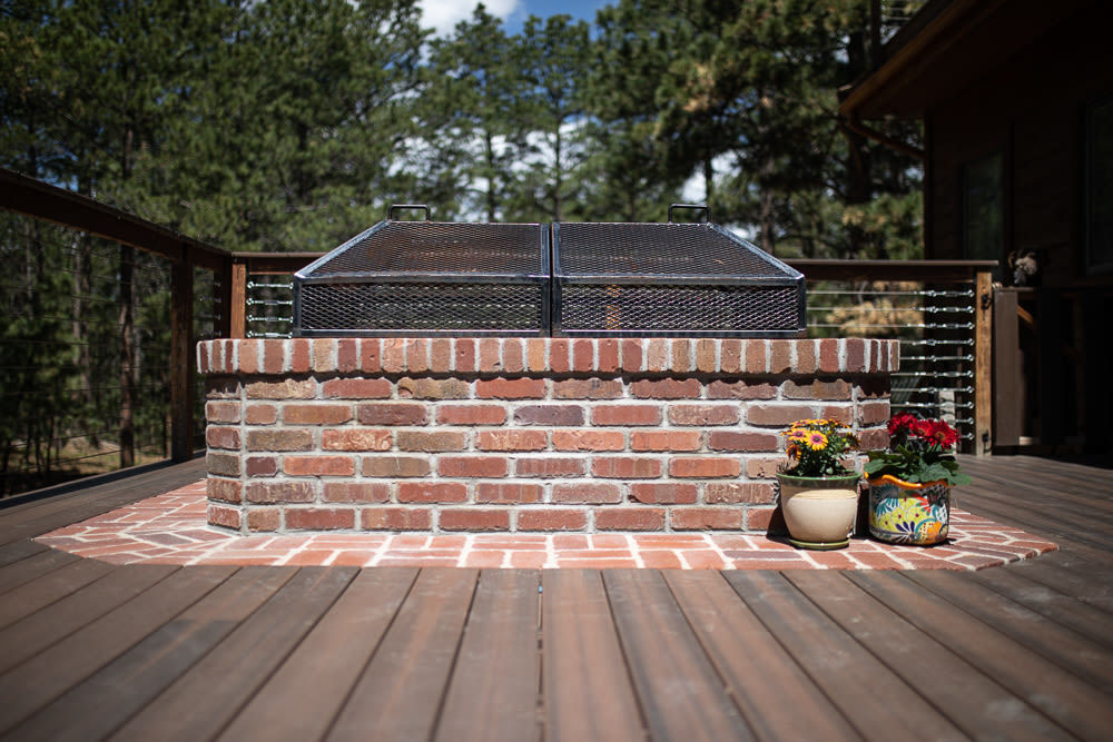 Brick fire pit with flowers